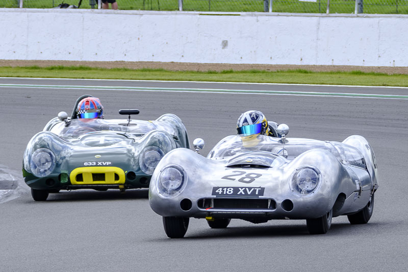 Pole sitter Andrew Kirkcaldy, Lotus 15 (#28) leads eventual race winner Olly Bryant in another Lotus 15 (#1) at the start of the RAC Woodcote & Stirling Moss Trophies race.