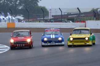 Trio of Ford cars racing at Silverstone
