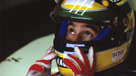 Ayrton Senna sitting in McLaren racing car at Silverstone 
